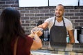 Waiter giving take away food