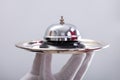 Waiter Hand Holding Service Bell In Tray Royalty Free Stock Photo