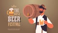 Waiter holding barrel and mug beer festival Oktoberfest party celebration concept Royalty Free Stock Photo