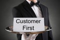 Waiter Holding Customer First Card On Tray