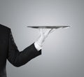 Waiter holding empty silver tray Royalty Free Stock Photo