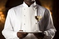 The waiter holds a tray with a glass of champagne Royalty Free Stock Photo