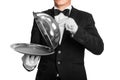 Waiter holds tray with metal lid