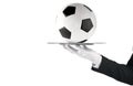 Waiter that holds a tray with soccer ball. Concept of first class service on soccer Royalty Free Stock Photo