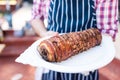 Waiter with large platter- porchetta