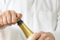 Waiter opening a botle of Champagne Royalty Free Stock Photo