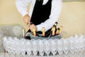 Waiter opening a bottle of white wine