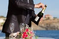 Waiter opens wedding champagne Royalty Free Stock Photo