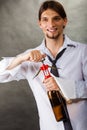 Waiter opens wine bottle. Royalty Free Stock Photo