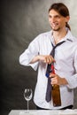 Waiter opens wine bottle. Royalty Free Stock Photo