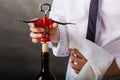 Waiter opens wine bottle. Royalty Free Stock Photo