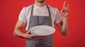 The waiter with peace sign.AI generated image Royalty Free Stock Photo