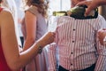 waiter pouring champagne in glass. elegant people holding glasses champagne at luxury wedding reception. toasting and cheering wi