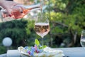 Waiter pouring a glas of cold rose wine, outdoor terrase, sunny Royalty Free Stock Photo