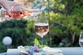 Waiter pouring a glas of cold rose wine, outdoor terrase, sunny Royalty Free Stock Photo