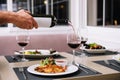 Waiter pouring red wine Royalty Free Stock Photo