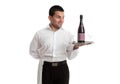 Waiter or servant looking at wine product