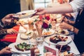 Waiter serve the clients table and gives plate with fruit salad on Sunday family brunch.