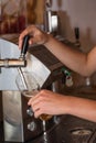 Waiter serves with beer - close-up