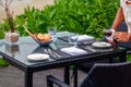 Waiter serves a table at a sea view restaurant Royalty Free Stock Photo