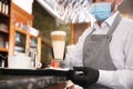 Waiter serving beverages in restaurant, closeup. Catering during coronavirus quarantine