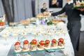 Waiter serving catering table Royalty Free Stock Photo