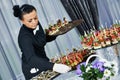 Waiter serving catering table Royalty Free Stock Photo