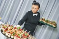 Waiter serving catering table Royalty Free Stock Photo