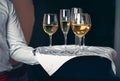 Waiter serving champagne on tray Royalty Free Stock Photo