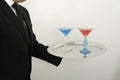 Waiter serving cocktails on a tray