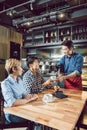 Waiter serving coffee in the cafe Royalty Free Stock Photo