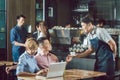 Waiter serving coffee to customer Royalty Free Stock Photo