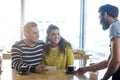 Waiter serving a cup of coffee to customer Royalty Free Stock Photo