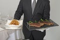 Waiter serving an entrecote Royalty Free Stock Photo