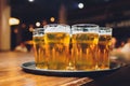 Waiter serving glasses of cold beer on the tray. Royalty Free Stock Photo