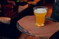 Waiter serving glasses of cold beer on the tray. Royalty Free Stock Photo