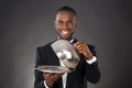 Waiter Serving Meal In Cloche