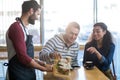 Waiter serving a plate of sandwich to customer Royalty Free Stock Photo