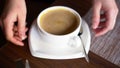 Waiter takes a cup of coffee with saucer and spoon Slow motion