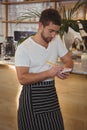 Waiter taking order at counter Royalty Free Stock Photo