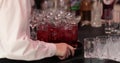 A waiter with a tray in his hands, on which there are many glasses with drinks. Royalty Free Stock Photo