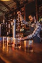 Waiter using beer tap at counter Royalty Free Stock Photo