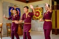 Waiter and waitress in the thai restaurant dancing