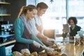 Waiter and waitress working at counter in cafÃÂ© Royalty Free Stock Photo