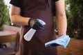 The waiter works in a restaurant in a medical mask, gloves during coronavirus pandemic Royalty Free Stock Photo