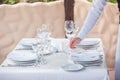 The waiter works in a restaurant on the summer terrace Royalty Free Stock Photo