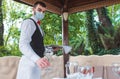 The waiter works in a restaurant on the summer terrace Royalty Free Stock Photo