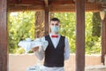 The waiter works in a restaurant on the summer terrace Royalty Free Stock Photo