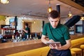 Waiters, bartenders barista work with the tablet in cafe bar res Royalty Free Stock Photo