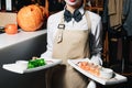 Waiters carrying plates with meat dish at a wedding Royalty Free Stock Photo